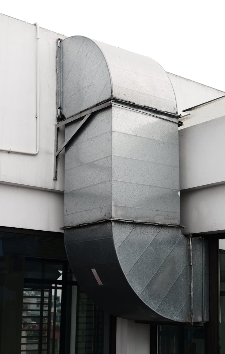 Facade of a Building with a Ventilation Pipe